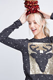 A polka-dot long sleeve top with sequins and a reindeer patch on front