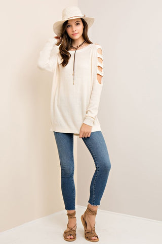 Solid scoop neck sweater top featuring ladder cutouts on shoulder